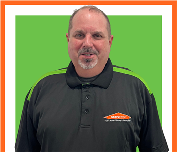 Bobby Glover, male, SERVPRO employee against green background