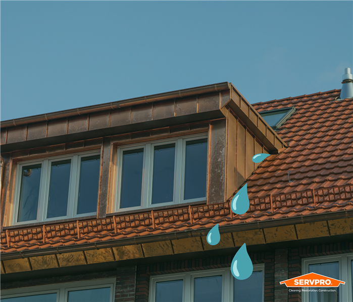 blue water drops coming from the roof of a home in East Fort Worth, Texas